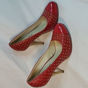 Size 7 red leather Studded high heels.
